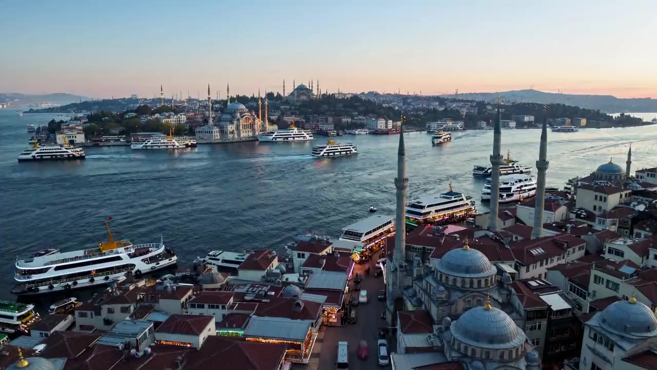 Aerial view over Eminönü at sunset, with the New Mosque and passenger ferries on the Golden Horn, Istanbul